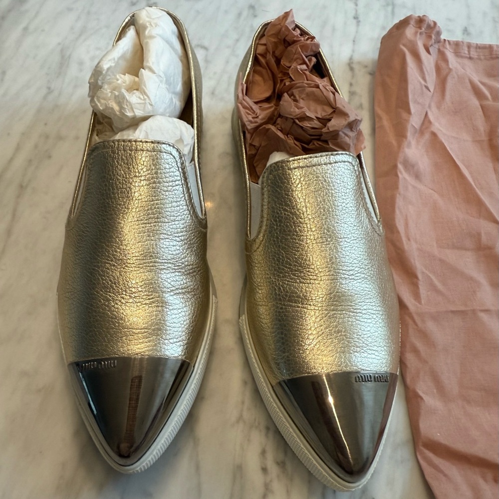 MIU MIU
Cap-Toe Metallic Gold Slip-On Sneakers